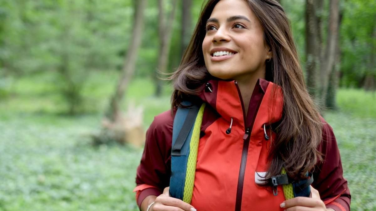 Beautiful, young woman hiking and enjoying in the nature