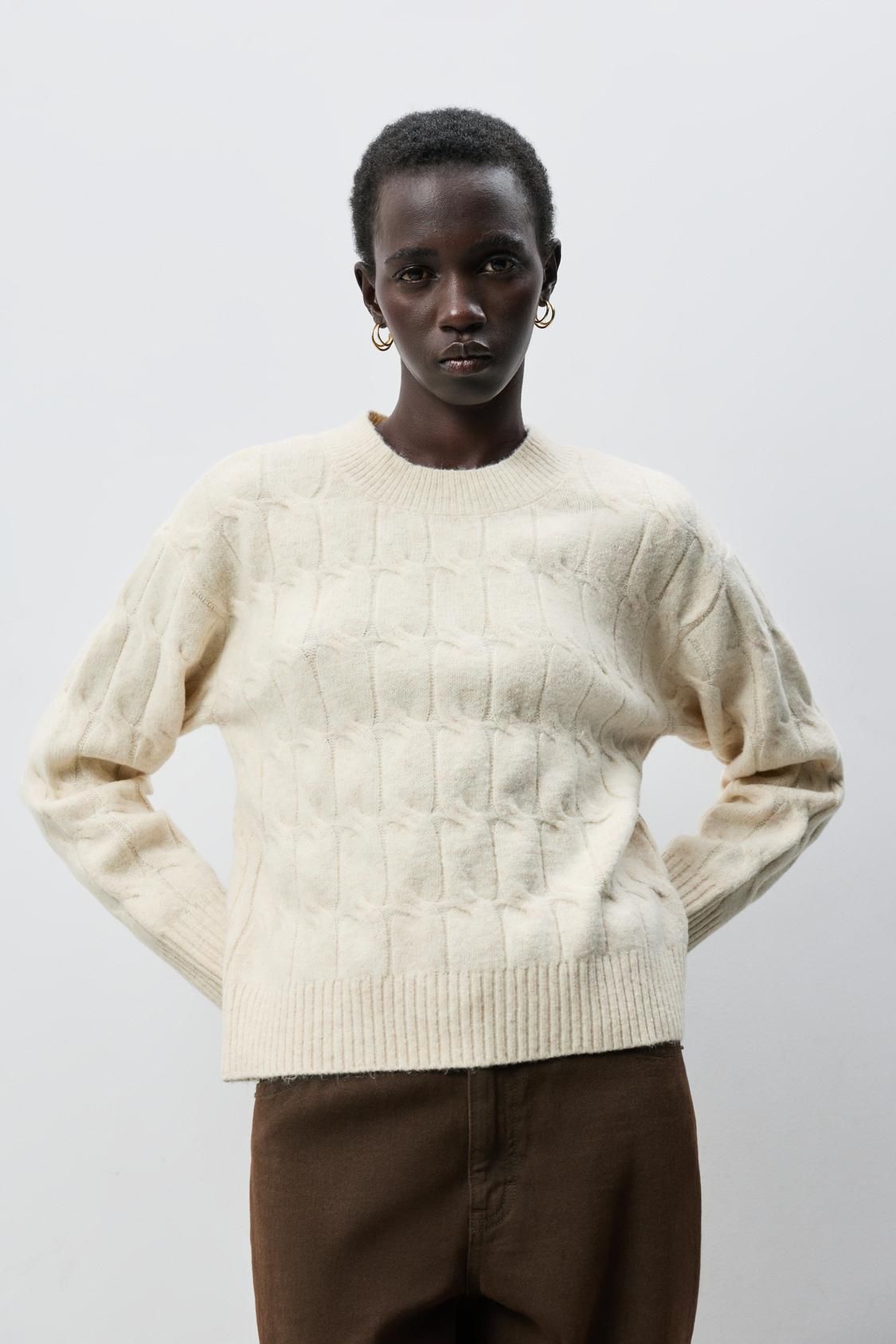 Pull blanc en maille torsadée