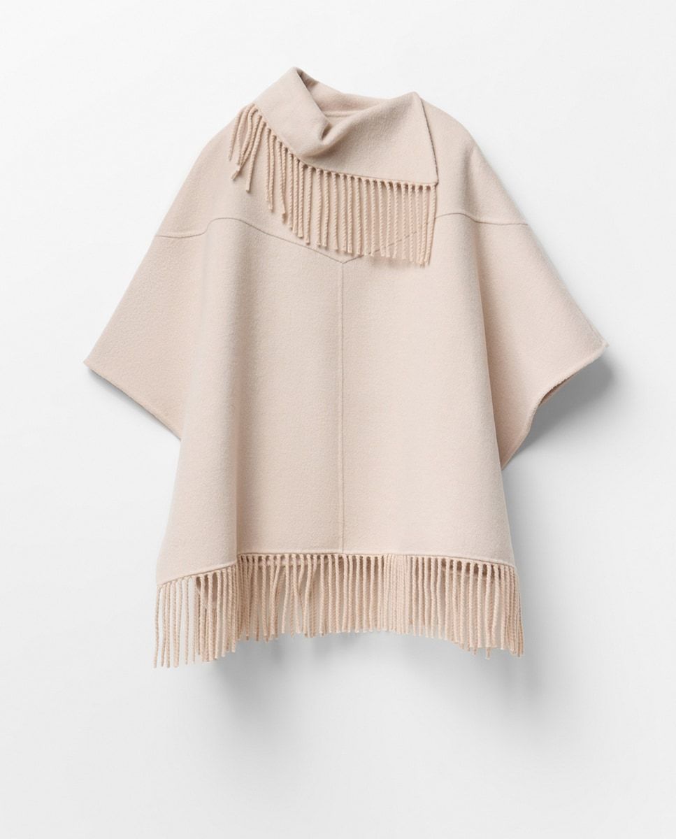 Cape tricotée blanche à franges