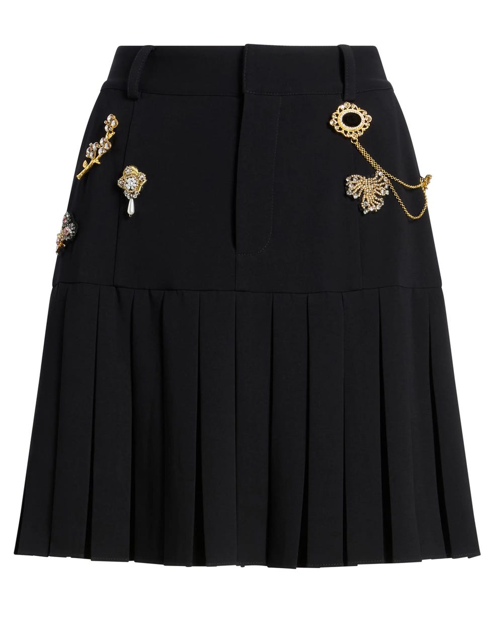 Jupe plissée ornée de broches Jupe plissée ornée de broches