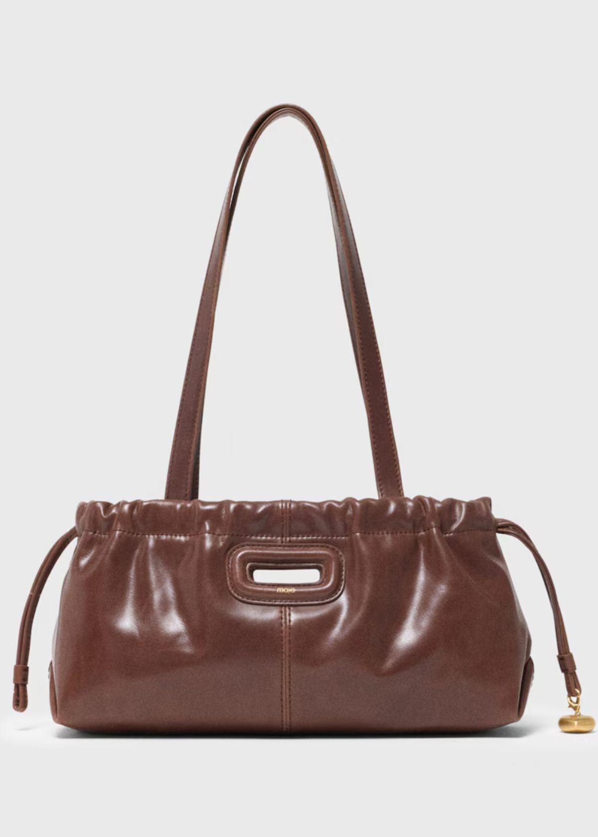 Sac bandoulière gazette vintage en cuir à fermeture aimantée et design shopping modulable Marron Maje